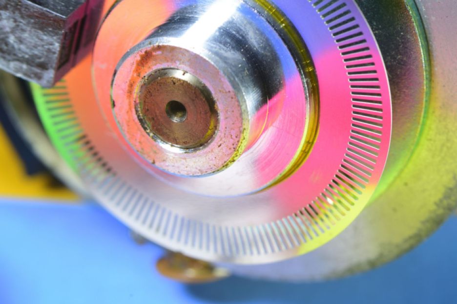 Detail of an encoder mounted on an electric motor.