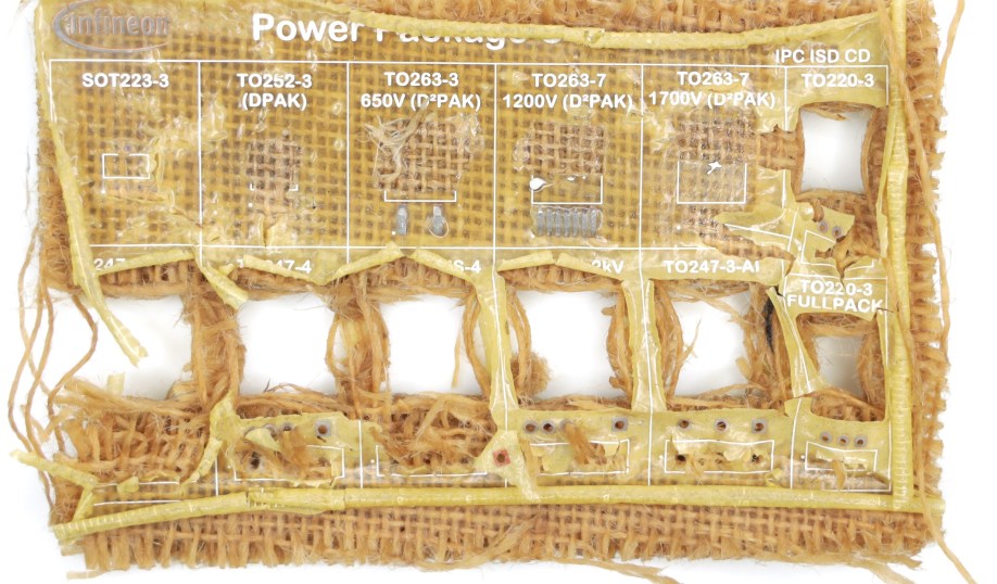 A dissassembled Infineon Soluboard, a recyclable PCB, showing the non-toxic polymer dissolving when immersed in hot water, leaving only compostable organic material.