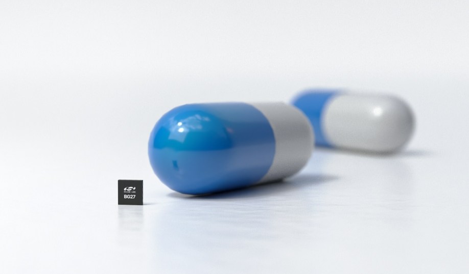 Silicon Labs' BG27 Bluetooth SoC, showing size next to a pill capsule.