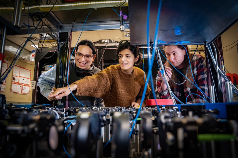 Stony Brook University's lead researcher Eden Figueroa (left) with Sonali Gera and Chase Wallace in the Stony Brook Quantum Information Laboratory.