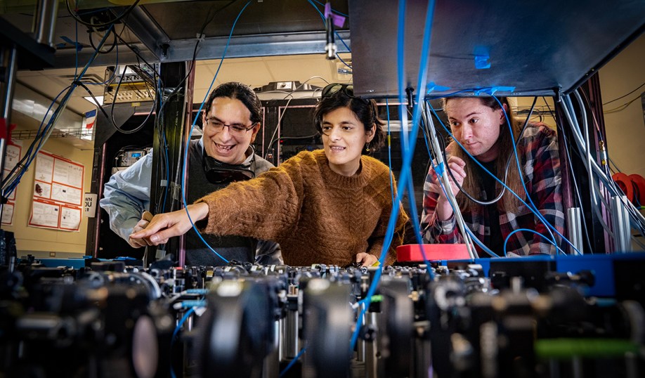 Stony Brook University's lead researcher Eden Figueroa (left) with Sonali Gera and Chase Wallace in the Stony Brook Quantum Information Laboratory.