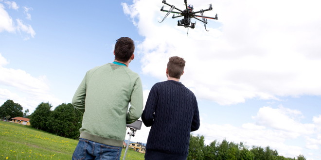 Hobbyists flying a drone