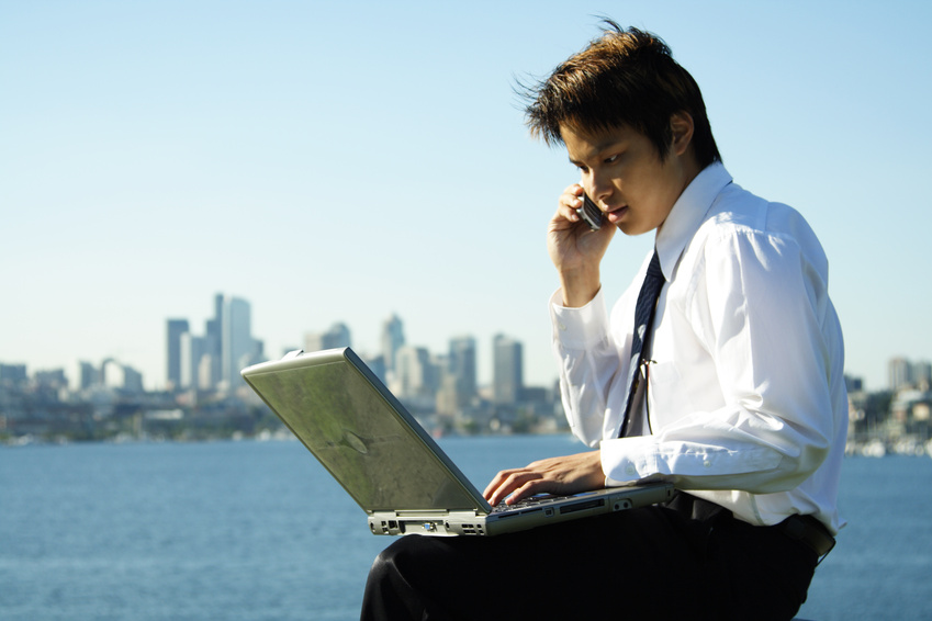 Person on laptop outdoors