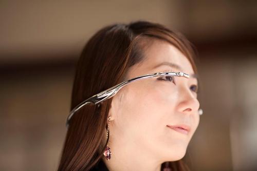 Woman wearing Telepathy One headset