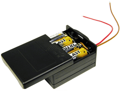 Battery holder features sliding covers, switch