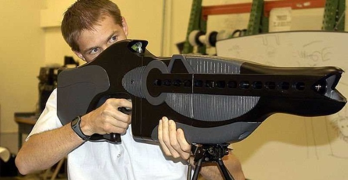 Man holding PHASR rifle