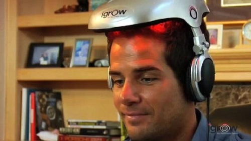 Man using iGrow hair helmet