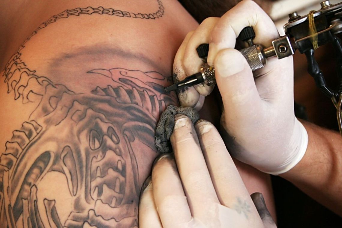 Tattoo artist tattoing