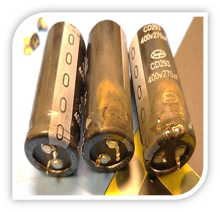 This photo shows burned capacitors caused by an open-air arc from a lightning strike.