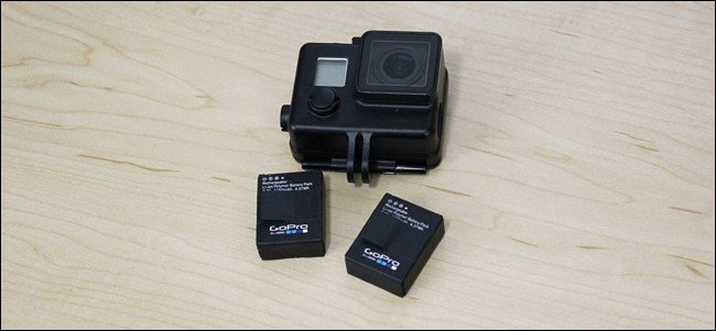 Black GoPro with batteries.