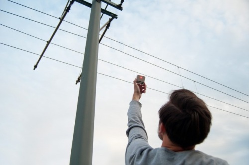 Converting power line electromagnetics into electricity
