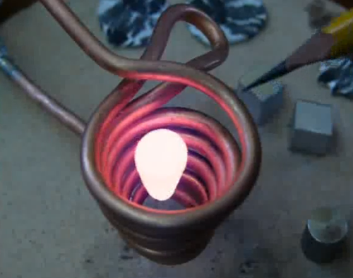 Metal being melted by electric coil