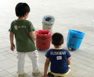 Children interacting with sociable trash box