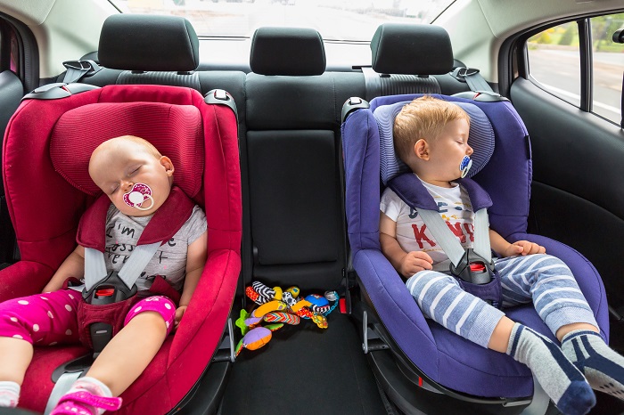 TI-children-asleep-in-car-seat-121972329-700px