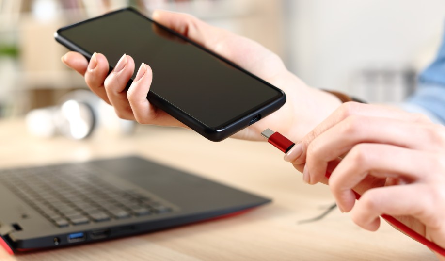 Shutterstock image of smartphone with USB-C cable.