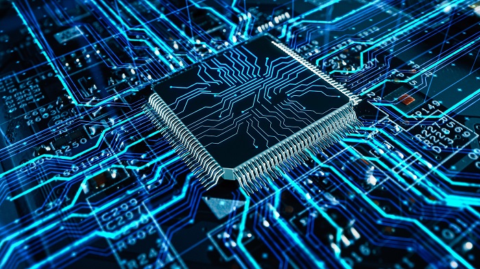 Computing and AI concept with a chip on a board.