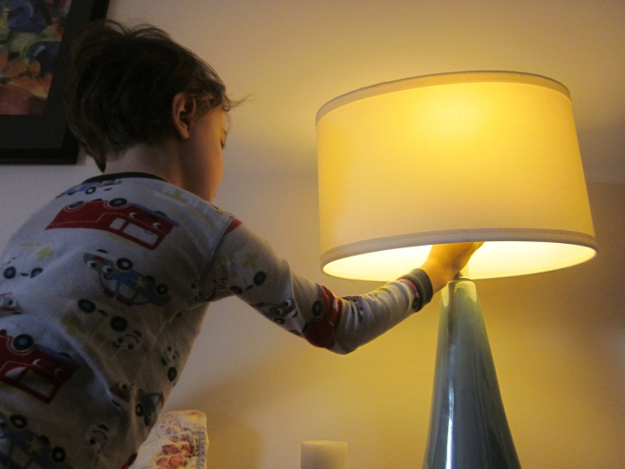 Child turning off light