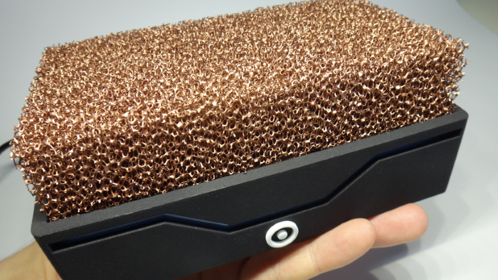 Person holding copper afro computer